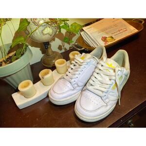 White and yellow Adidas Continental 80 white trainers.